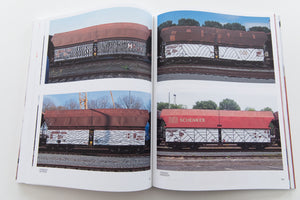 121/183 761 PHOTOS OF RED-BROWN STEEL FREIGHT WAGONS WITH A PAINTING ON THE SIDE